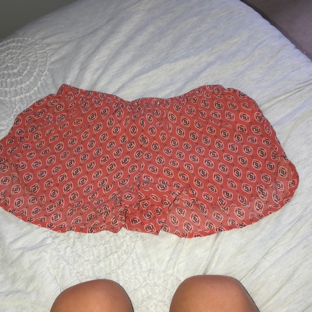 red and white flowy shorts with floral pattern